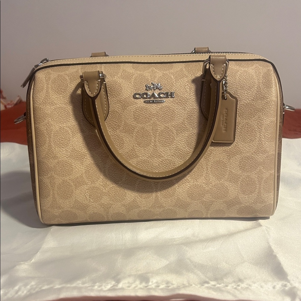 Coach Beige Medium Size Rowan with Signature Design.
